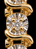 Close-up of a yellow gold bracelet featuring cushion-cut diamonds with four round diamonds set in each link, photographed against a solid black background.